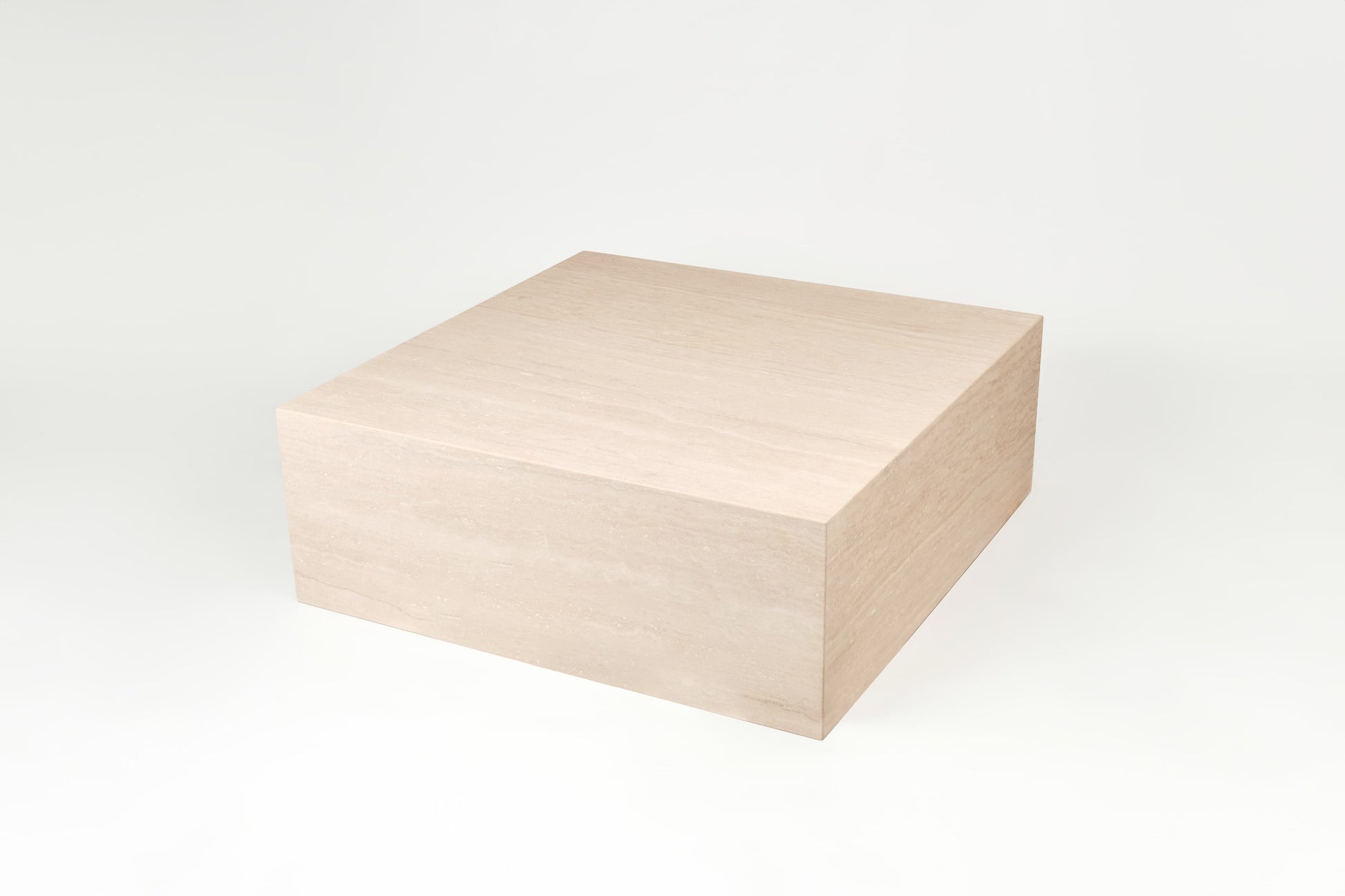 Eleganter Couchtisch Gina aus Travertin mit klaren Linien und natürlicher Steinstruktur, ideal für moderne und minimalistische Inneneinrichtungen.